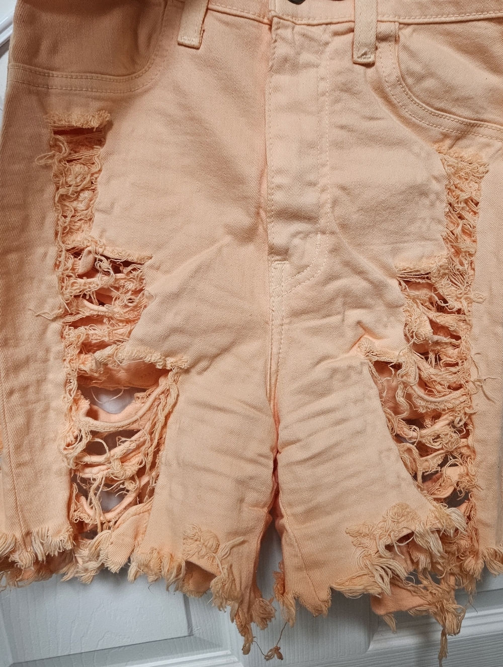 High Rise Distressed Peach Denim Cutoff Shorts